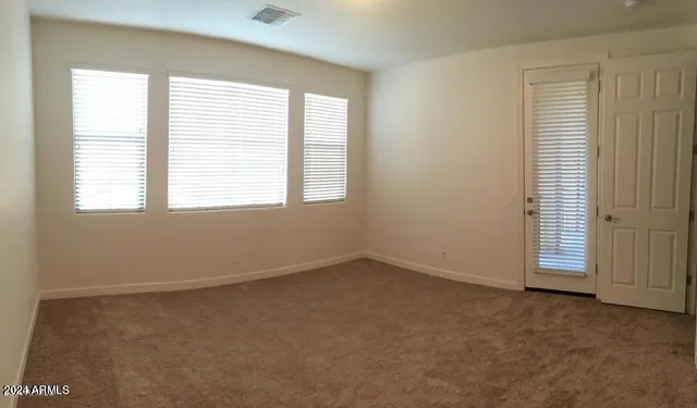 a bathroom with a double vanity sink and mirror