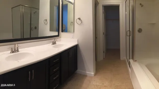 a view of staircase with white walls and white door