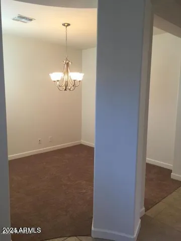 an empty room with closet area