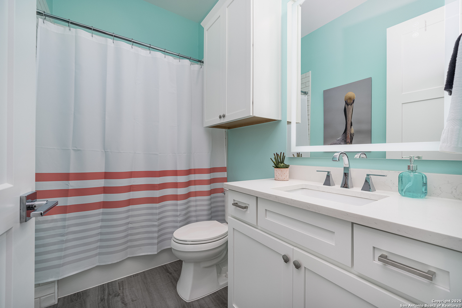 107 Windjammer Road Rockport, TX 78382 - Photo 22 of 52 a bathroom with a sink a toilet and vanity