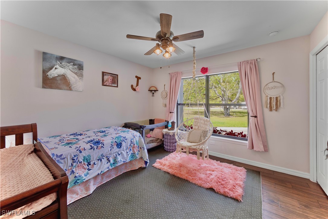 7583 18th Place LaBelle, FL 33935 - Photo 23 of 36 a bedroom with a bed and a window