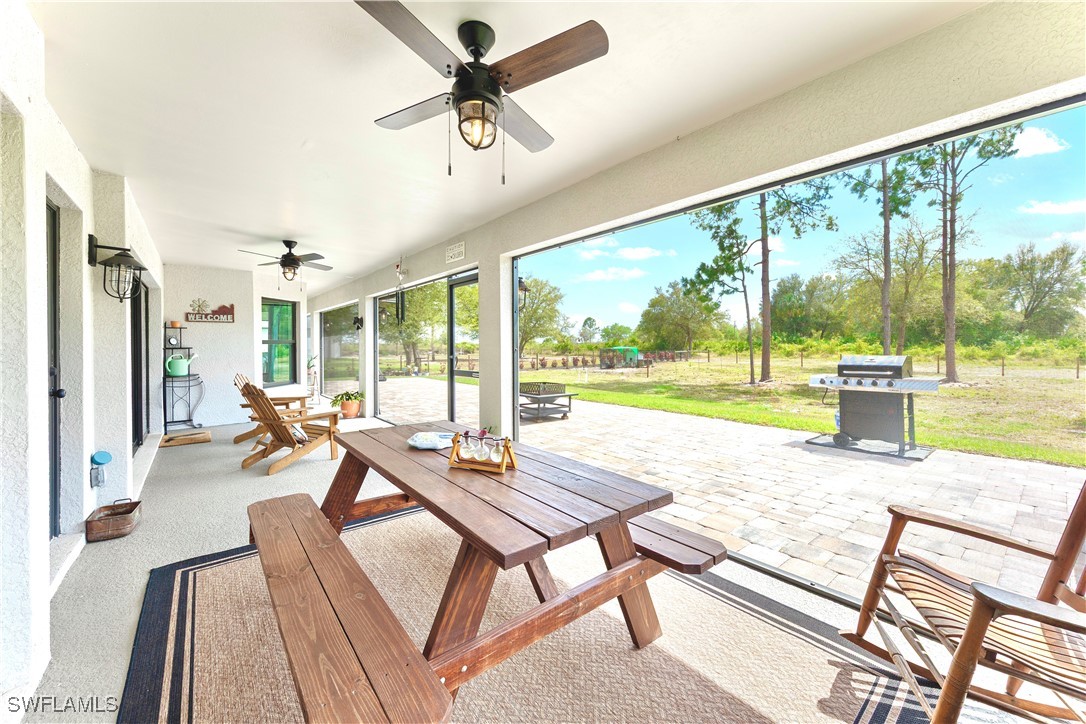 7583 18th Place LaBelle, FL 33935 - Photo 27 of 36 a living room with hardwood floor and a large window