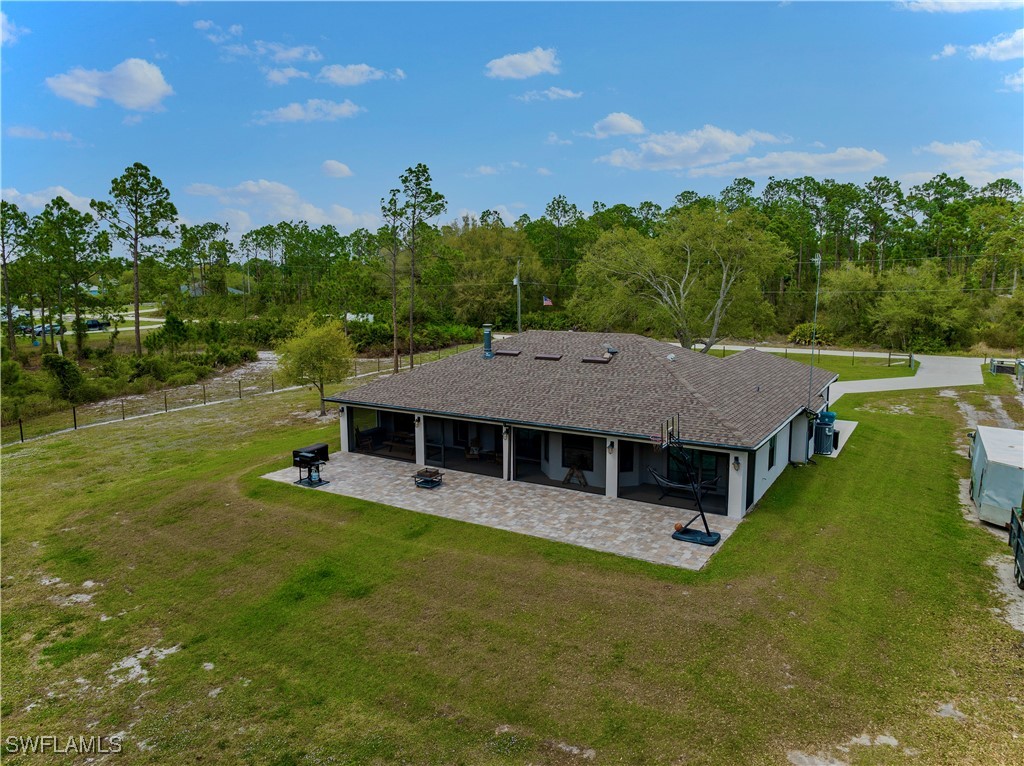 7583 18th Place LaBelle, FL 33935 - Photo 32 of 36 a aerial view of a house with swimming pool and a yard