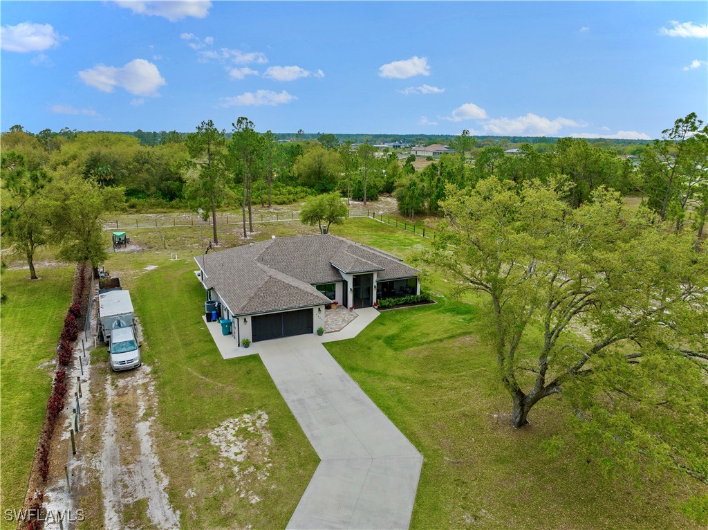 7583 18th Place LaBelle, FL 33935 - Photo 33 of 36 a view of a house with a yard