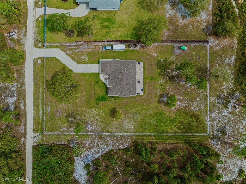 7583 18th Place LaBelle, FL 33935 - Photo 36 of 36 an aerial view of residential house with pool and yard