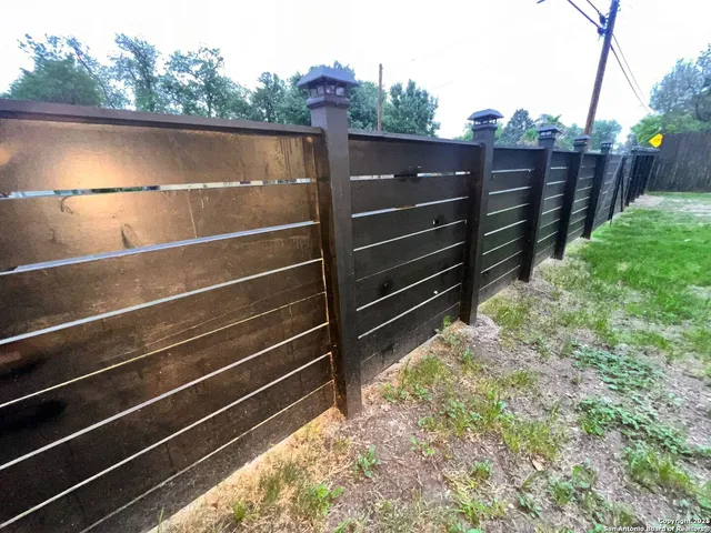 a view of outdoor space with wooden floor and fence