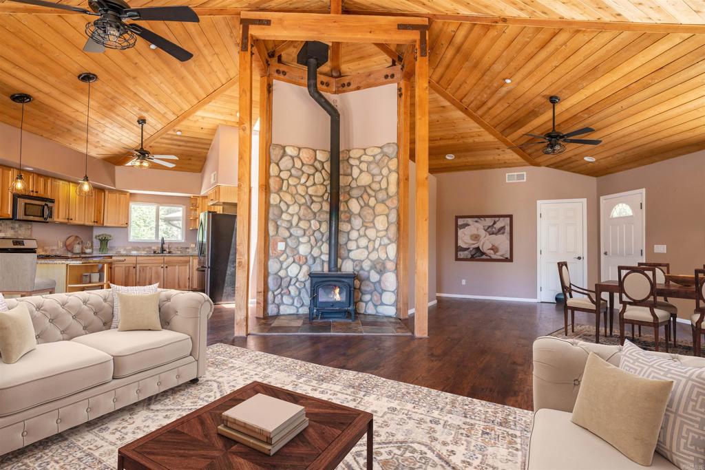 5065 Mountainbrook Road Santa Ysabel, CA 92070 - Photo 1 of 1 a living room with furniture a rug and a chandelier