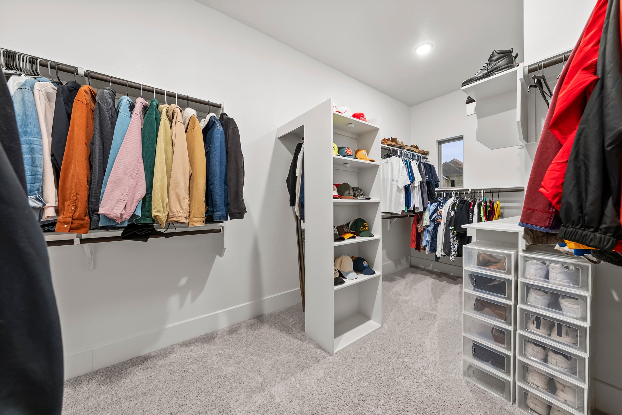 124 Low River Lane Georgetown, TX 78628 - Photo 20 of 38 a view of walk in closet with clothes and shoes