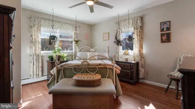 a bedroom with a bed and a tv