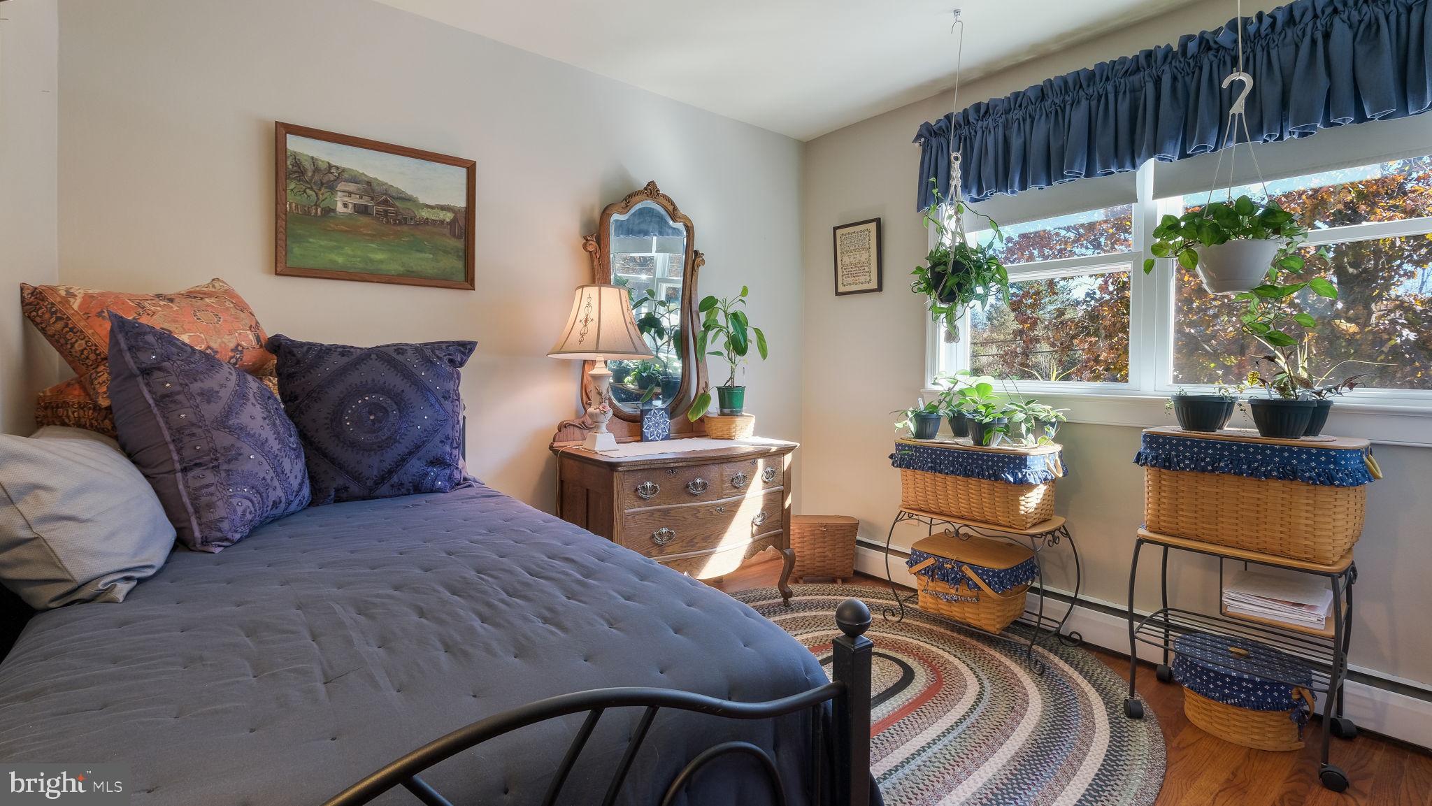 7078 Easton Road Pipersville, PA 18947 - Photo 24 of 45 a living room with furniture a window and potted plants