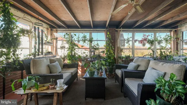 a outdoor living space with furniture and garden view