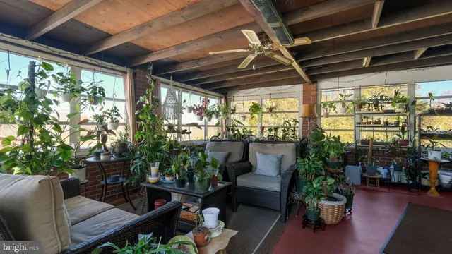 a view of a house with patio and a yard