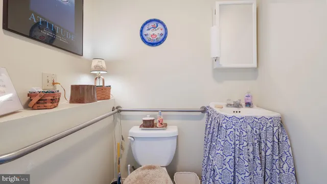 a view of a chair and tables in the garden