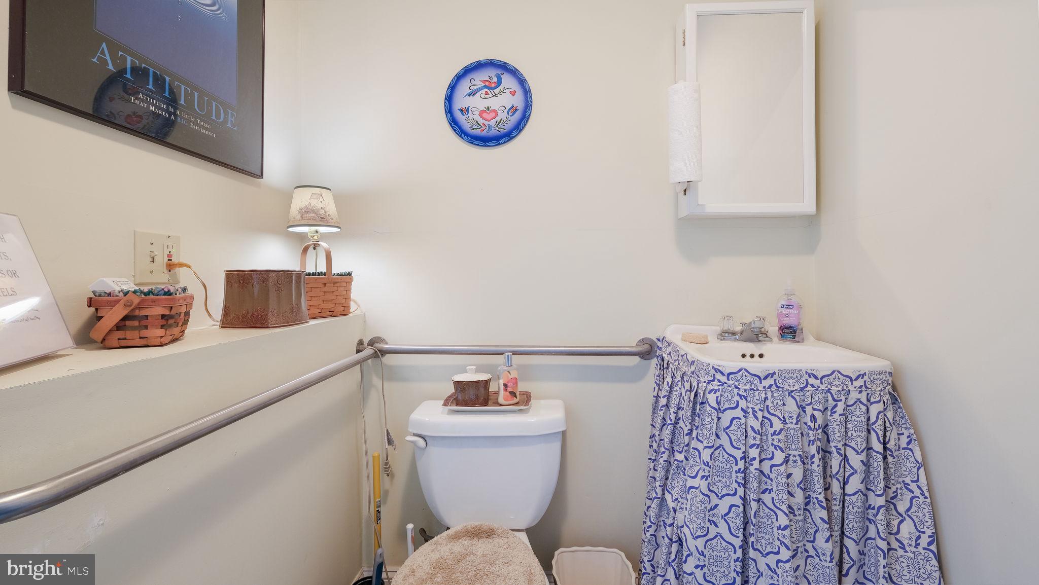 7078 Easton Road Pipersville, PA 18947 - Photo 40 of 45 a bathroom with a sink mirror vanity and toilet