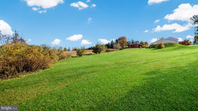 a view of a building with a big yard