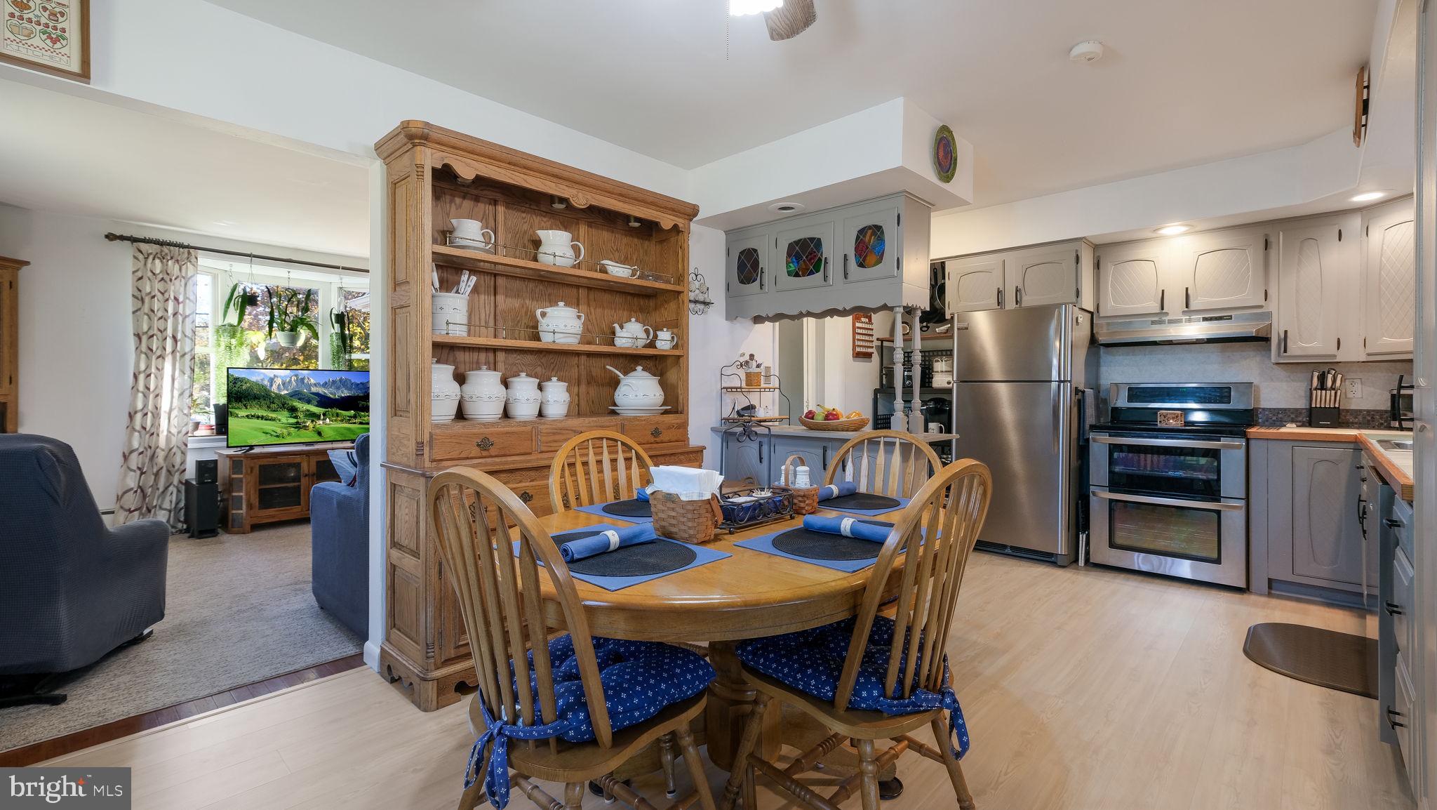7078 Easton Road Pipersville, PA 18947 - Photo 9 of 45 a dining room with furniture and a floor to ceiling window