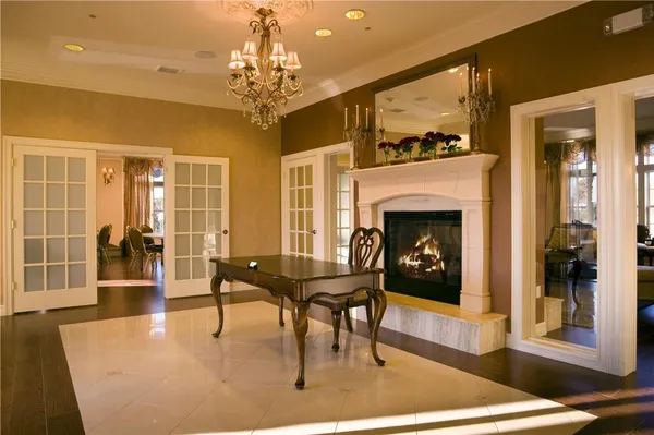 a living room with furniture a dining table and a fireplace