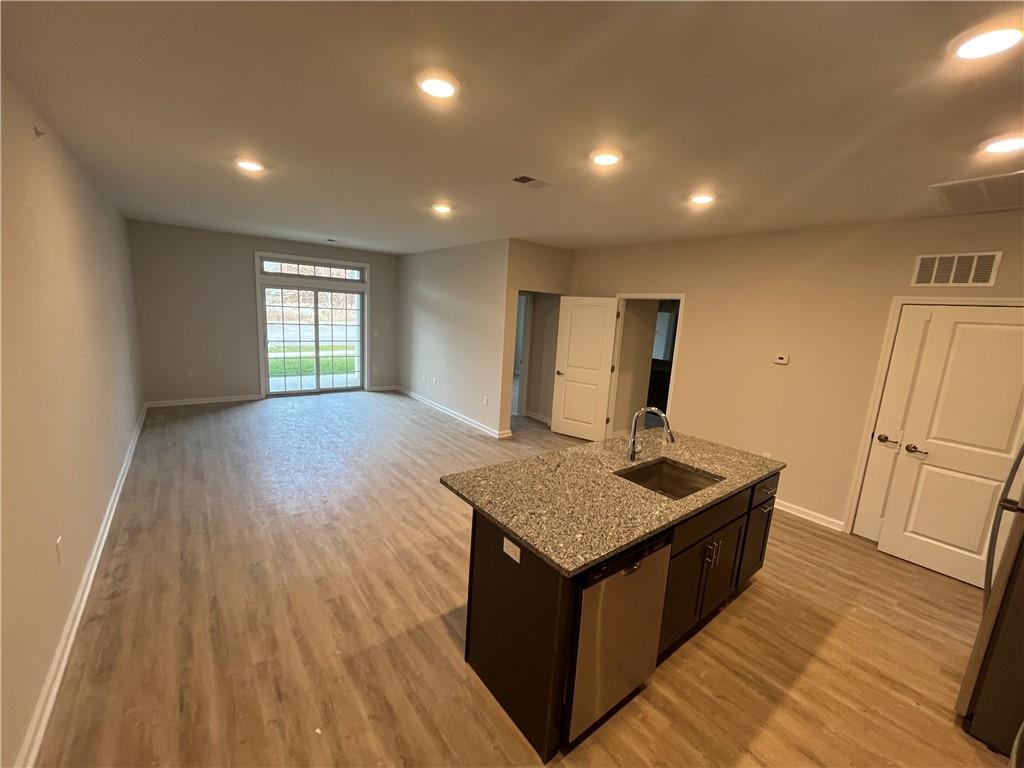 313 Tower Ridge Circle Middletown, NY 10941 - Photo 3 of 17 a kitchen with sink cabinets and wooden floor