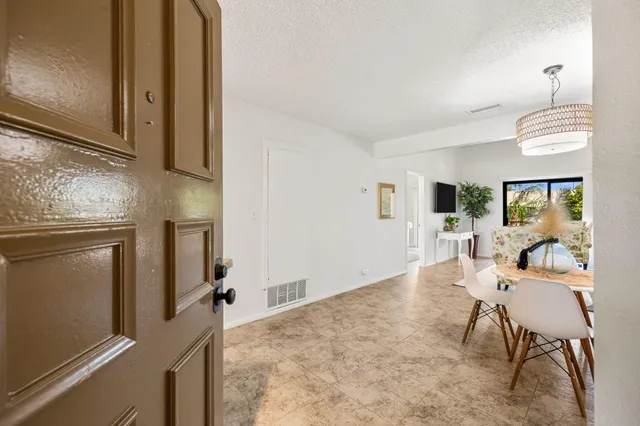 a living room with furniture and a table