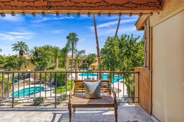 a balcony with view of outdoor space