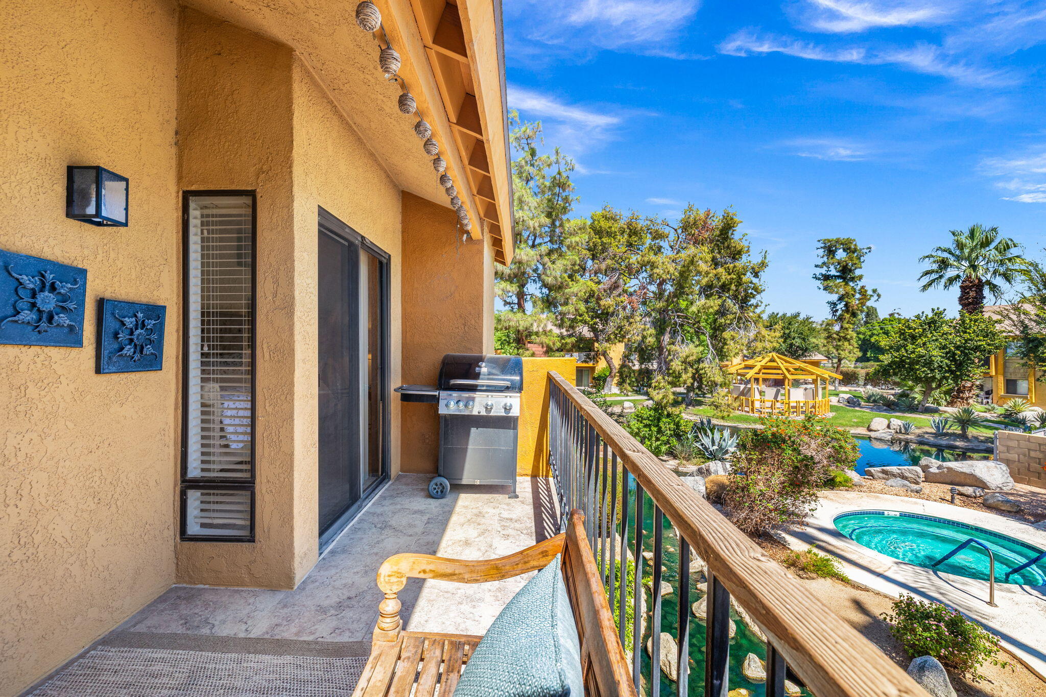 48255 Monroe Street, Unit 59 Indio, CA 92201 - Photo 25 of 58 a balcony with view of outdoor space