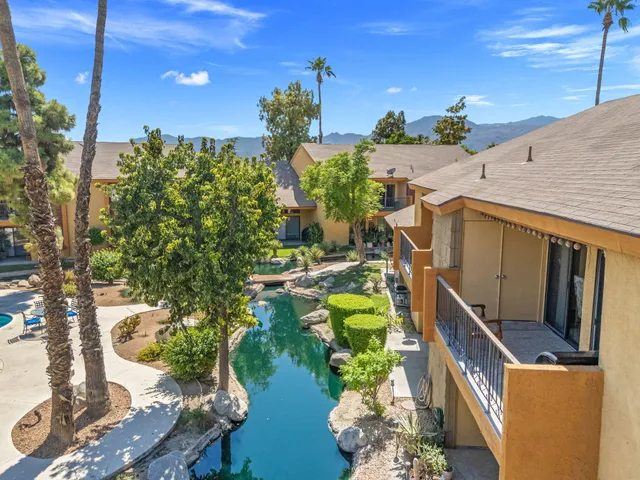 an aerial view of a house with a lot of flower plants