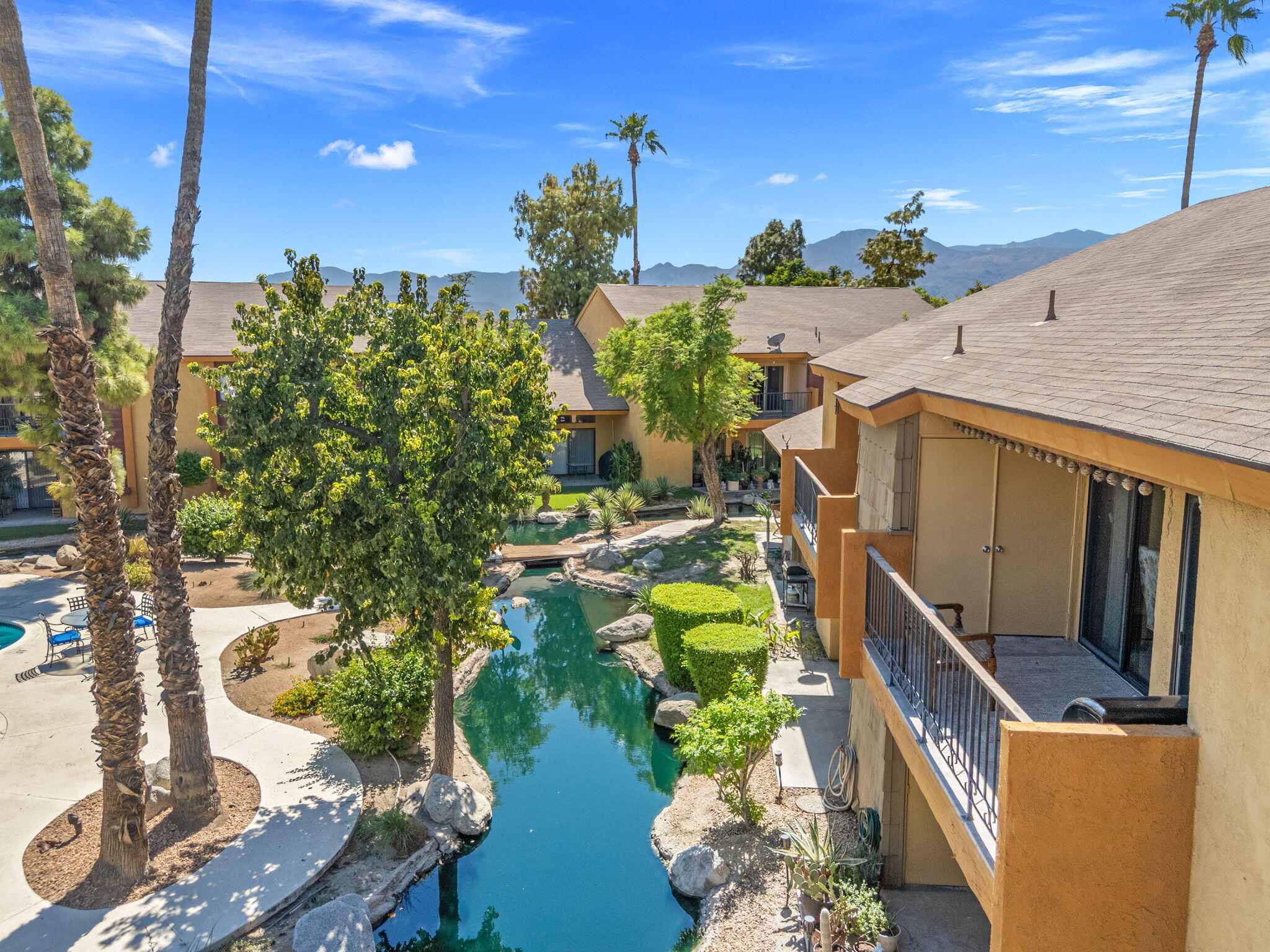 48255 Monroe Street, Unit 59 Indio, CA 92201 - Photo 26 of 58 a balcony with chairs and a table