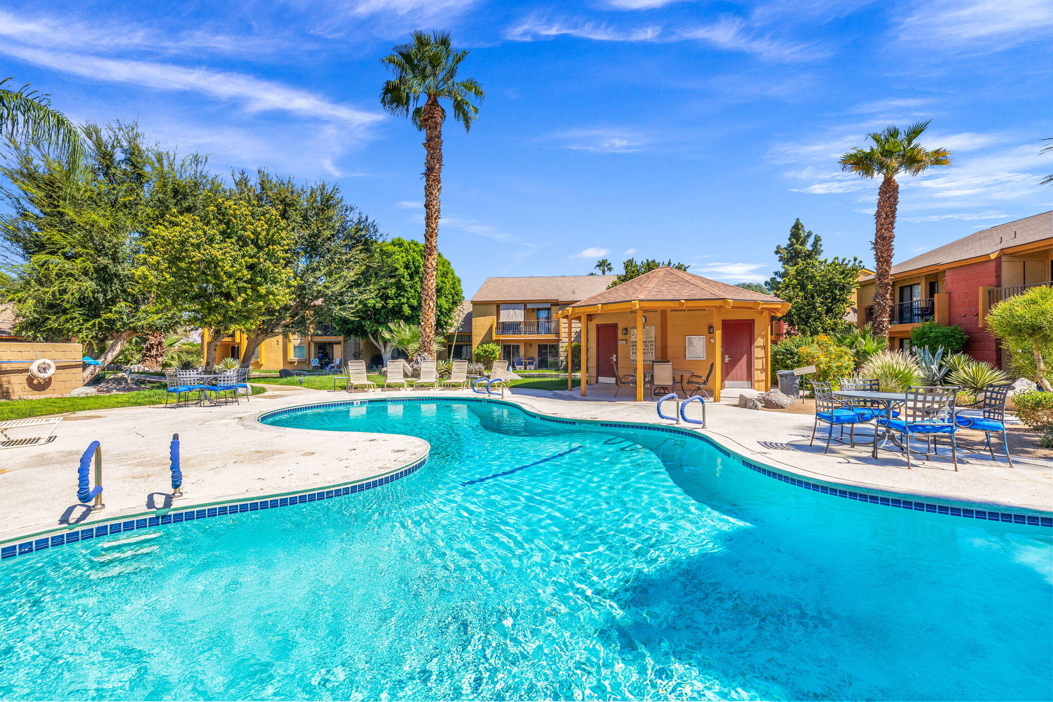 48255 Monroe Street, Unit 59 Indio, CA 92201 - Photo 39 of 58 a front view of a house with swimming pool having outdoor seating