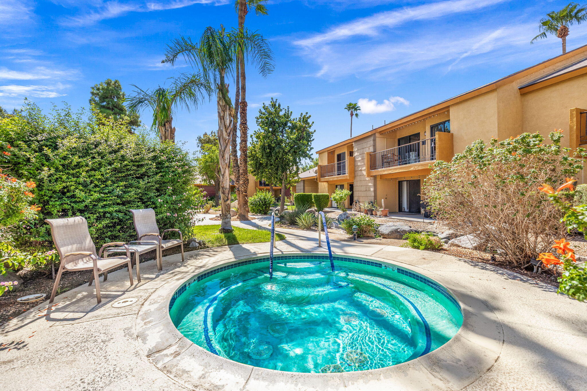 48255 Monroe Street, Unit 59 Indio, CA 92201 - Photo 41 of 58 a swimming pool with outdoor seating and yard