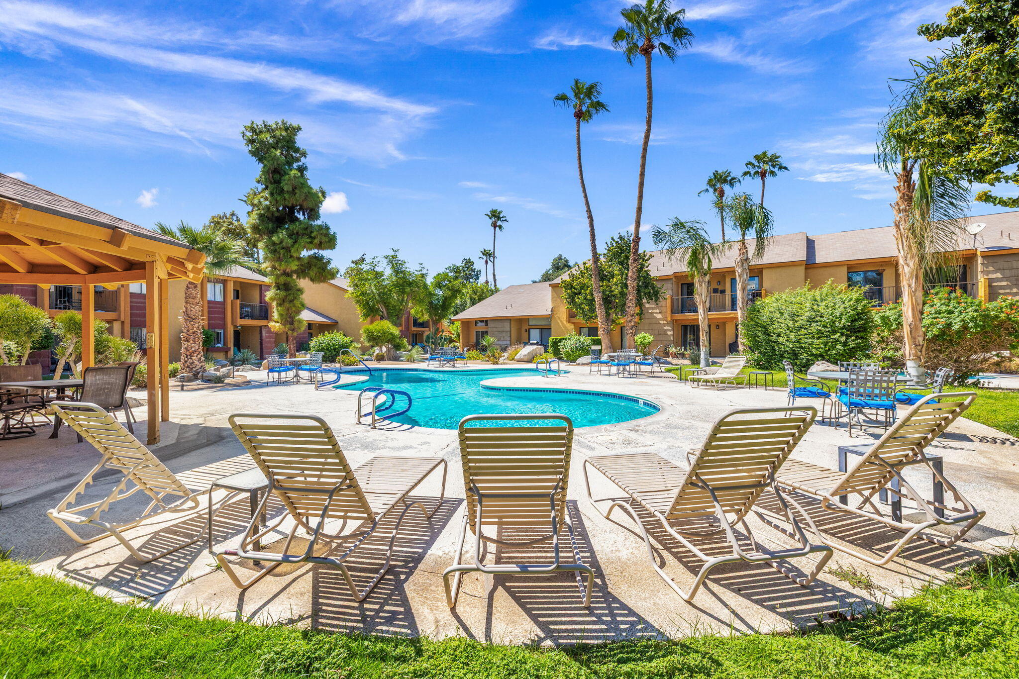 48255 Monroe Street, Unit 59 Indio, CA 92201 - Photo 42 of 58 a view of swimming pool with outdoor seating and a patio