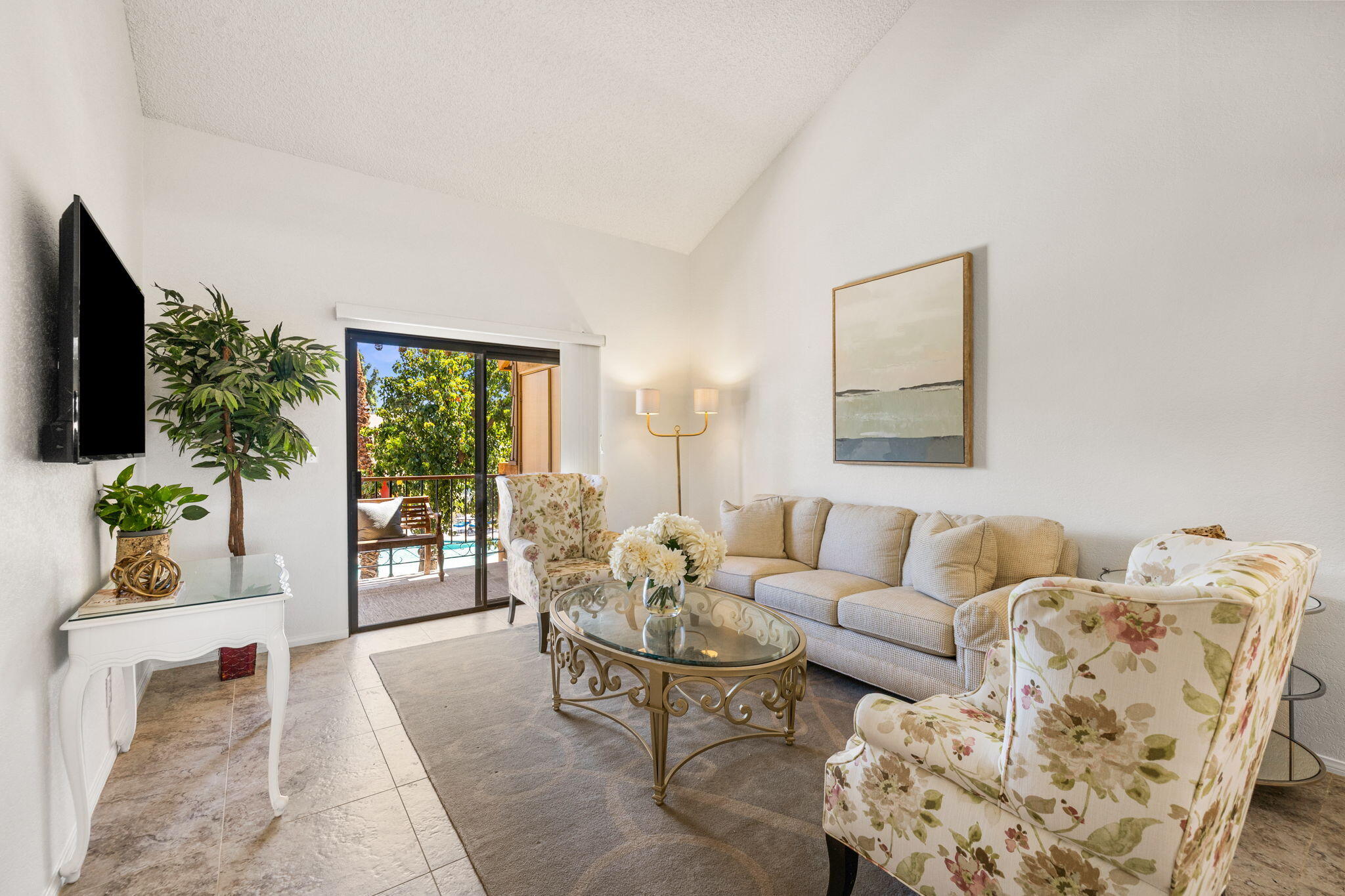 48255 Monroe Street, Unit 59 Indio, CA 92201 - Photo 5 of 58 a living room with furniture and a flat screen tv