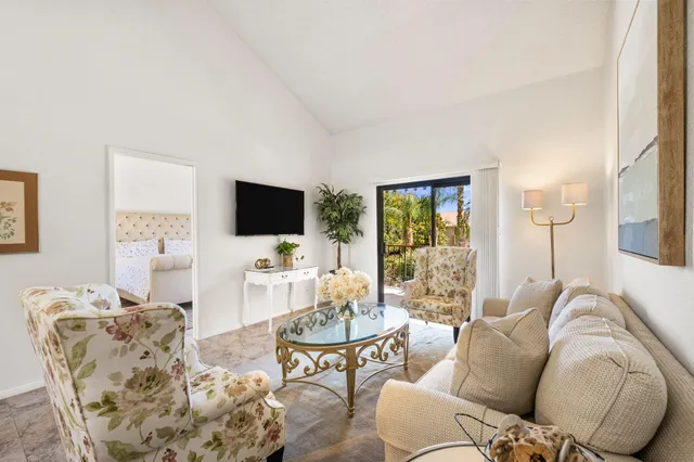 a living room with furniture fireplace and a flat screen tv
