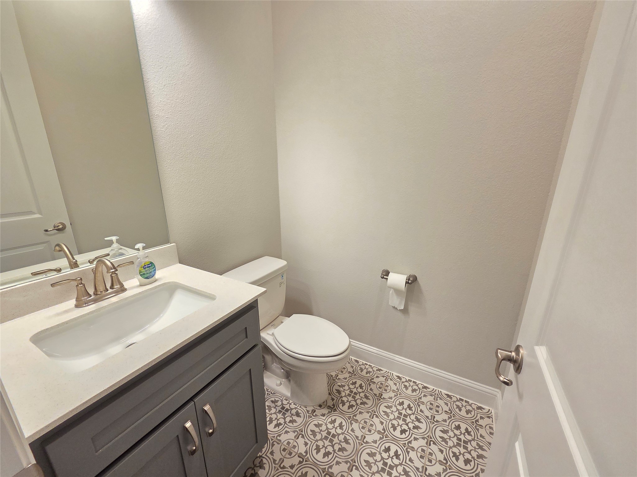 600 C-Bar Ranch Trail, Unit 121 Cedar Park, TX 78613 - Photo 15 of 32 A well-appointed bathroom with a patterned tile floor and a modern vanity.