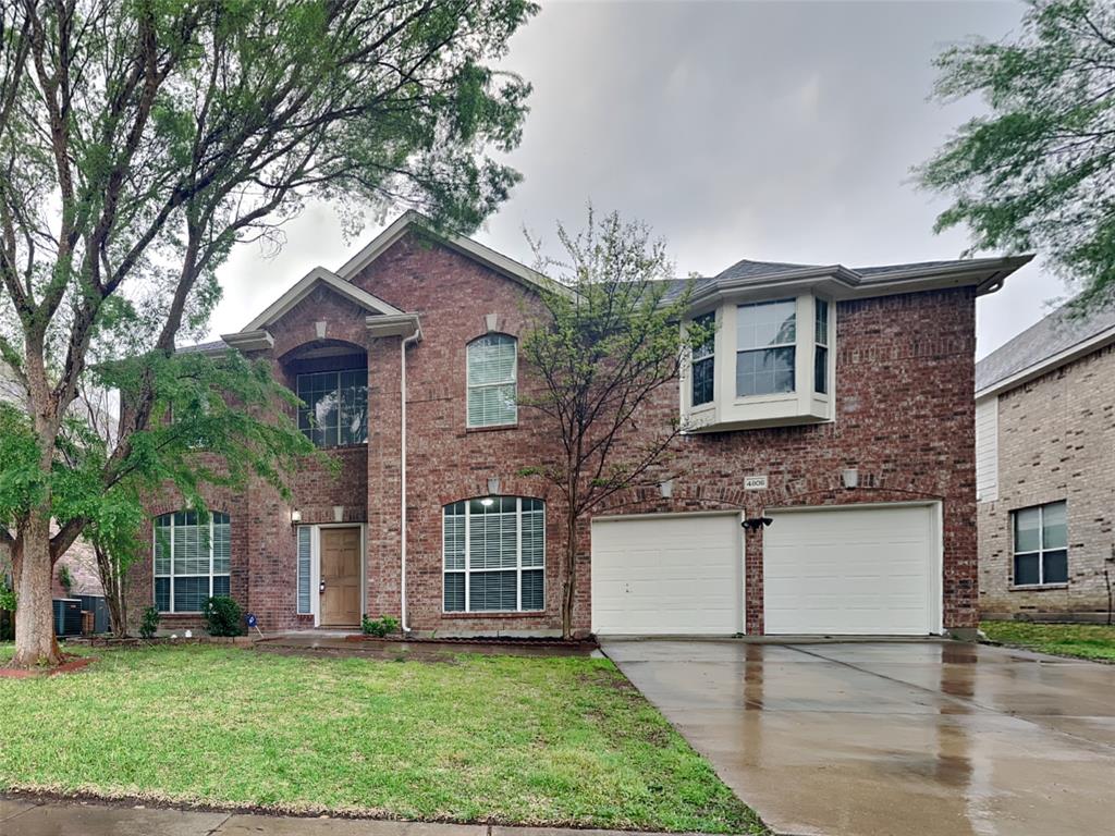 4808 Winterview Drive Mansfield, TX 76063 - Photo 1 of 32 View of front facade with an attached garage, a front lawn, concrete driveway, and brick siding