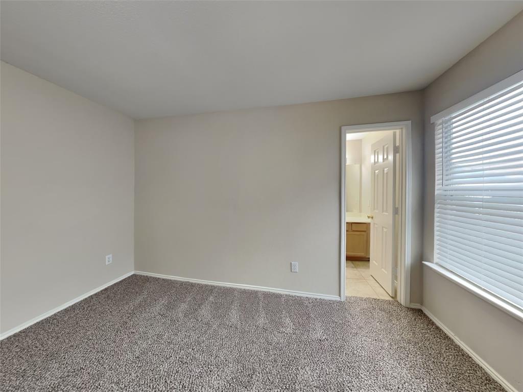 4808 Winterview Drive Mansfield, TX 76063 - Photo 14 of 32 Empty room with light carpet and baseboards