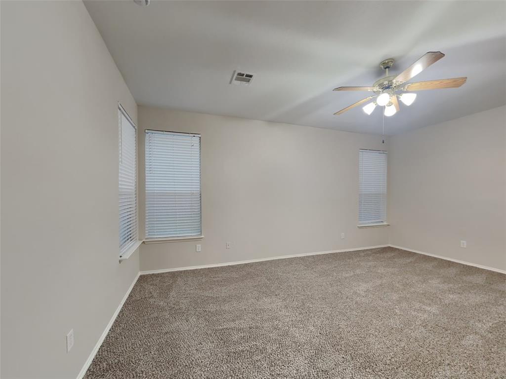 4808 Winterview Drive Mansfield, TX 76063 - Photo 7 of 32 Carpeted spare room with baseboards, ceiling fan, and visible vents