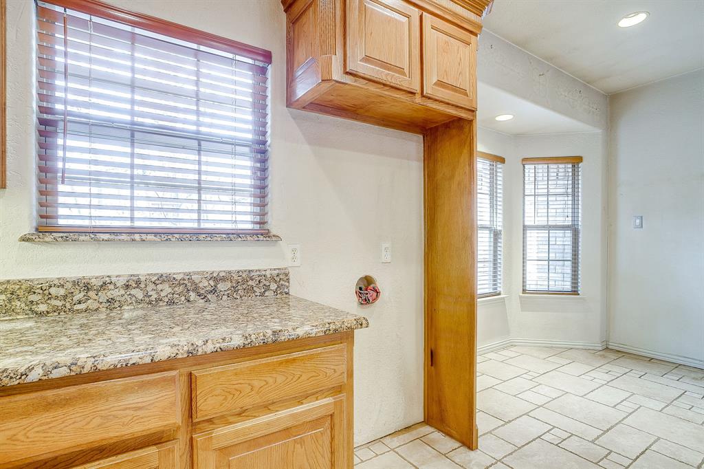 2780 Pear Orchard Road Granbury, TX 76048 - Photo 15 of 40 a bathroom with a granite countertop sink and a mirror