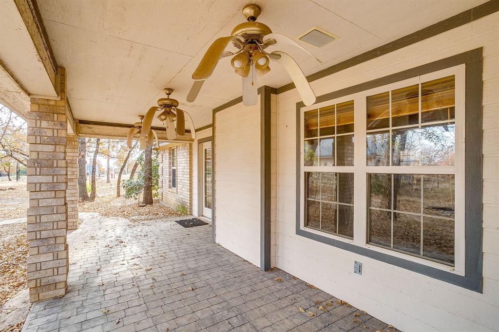 2780 Pear Orchard Road Granbury, TX 76048 - Photo 25 of 40 a view of a house with a large window