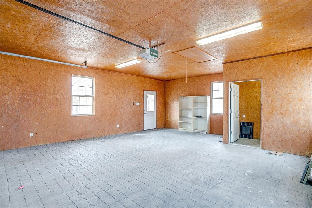 2780 Pear Orchard Road Granbury, TX 76048 - Photo 30 of 40 a view of a empty room with closet and windows
