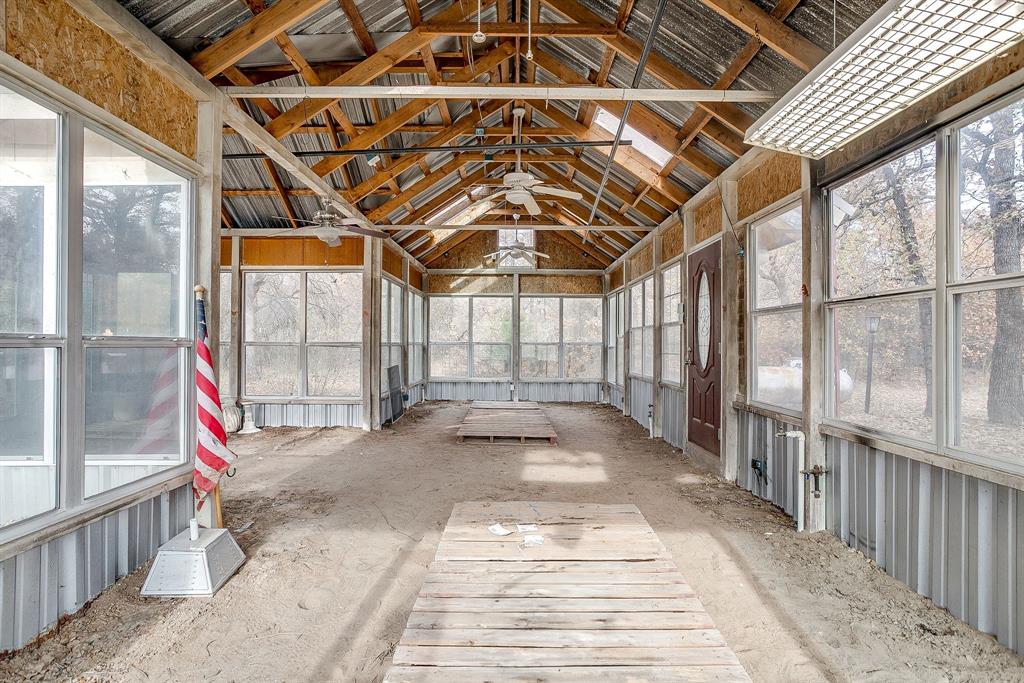 2780 Pear Orchard Road Granbury, TX 76048 - Photo 34 of 40 a view of a building with a porch