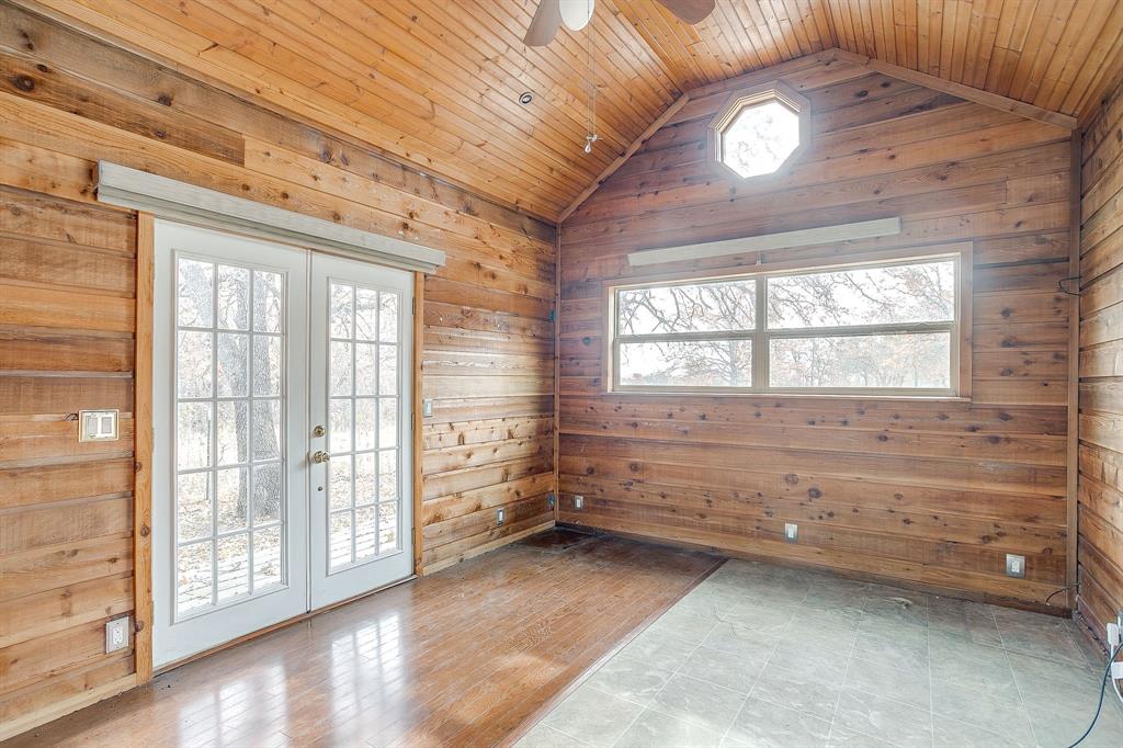 2780 Pear Orchard Road Granbury, TX 76048 - Photo 37 of 40 a view of room with window and hardwood floor