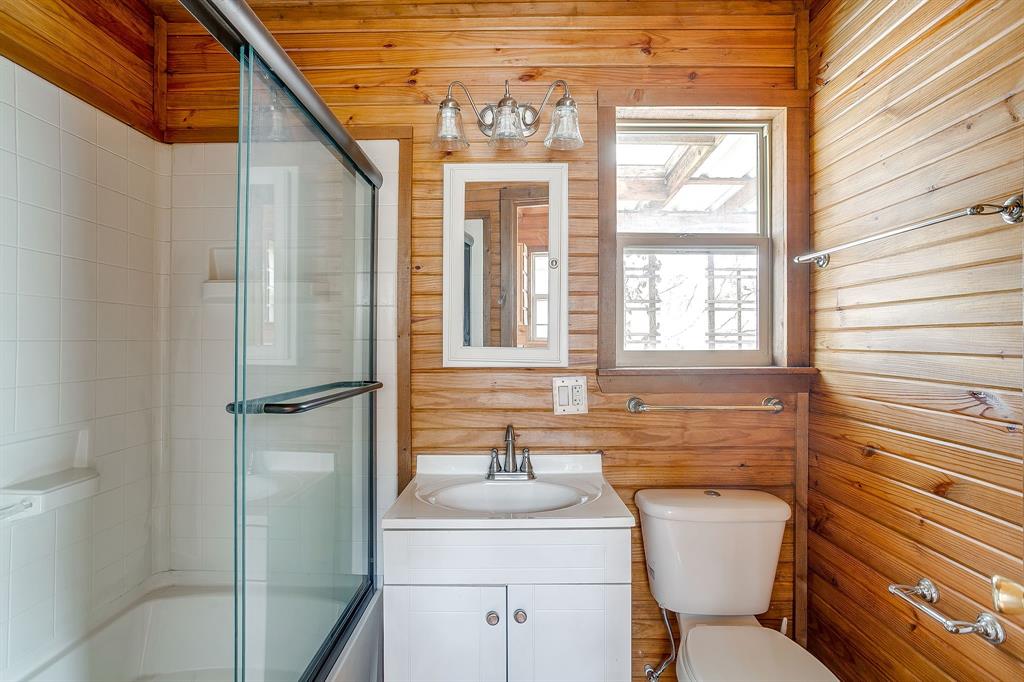 2780 Pear Orchard Road Granbury, TX 76048 - Photo 40 of 40 a bathroom with a toilet sink and mirror