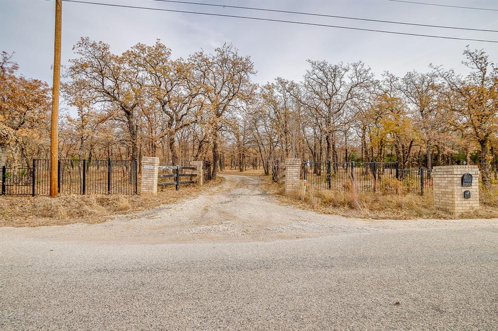 2780 Pear Orchard Road Granbury, TX 76048 - Photo 5 of 40 a view of road with large trees
