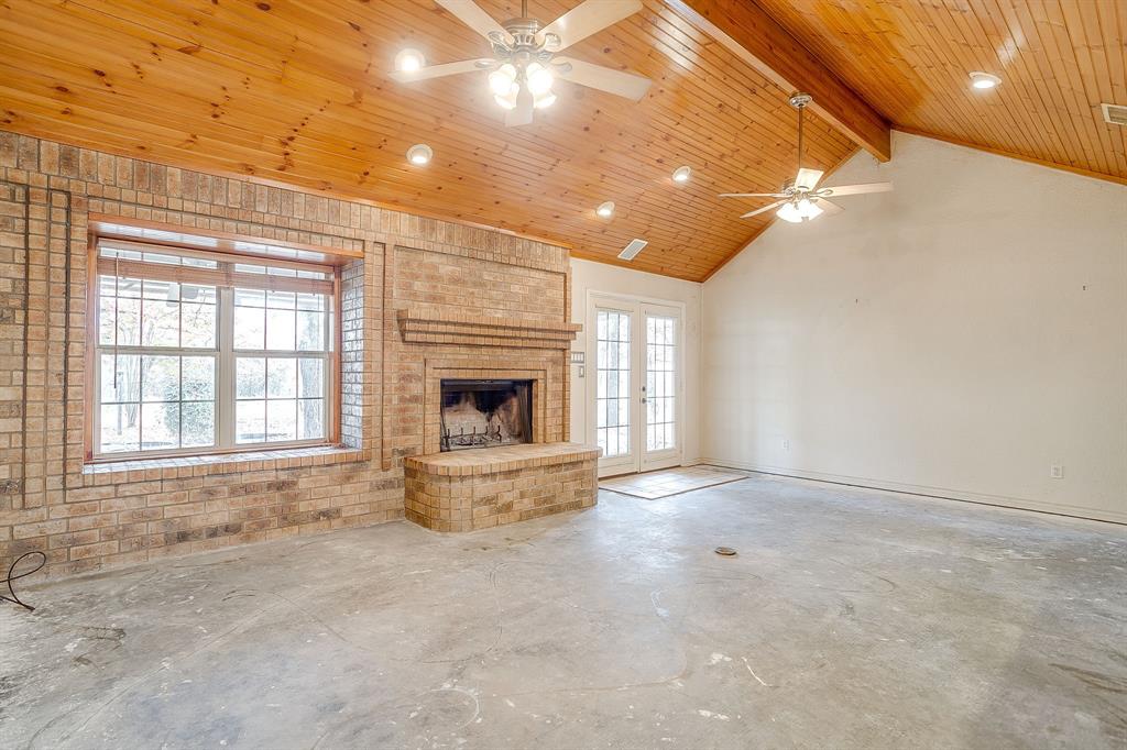 2780 Pear Orchard Road Granbury, TX 76048 - Photo 10 of 40 a view of empty room with a fireplace