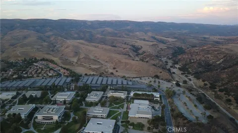 an aerial view of residential houses and outdoor space