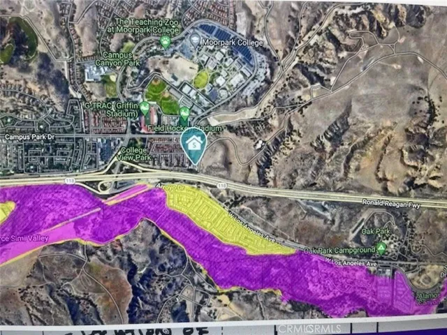 a view of outdoor space with seating area and trees around