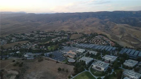 an aerial view of residential house with parking space