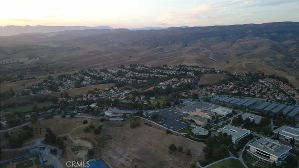 an aerial view of residential house and green space