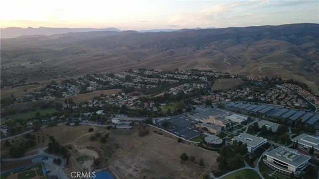 an aerial view of residential house and green space