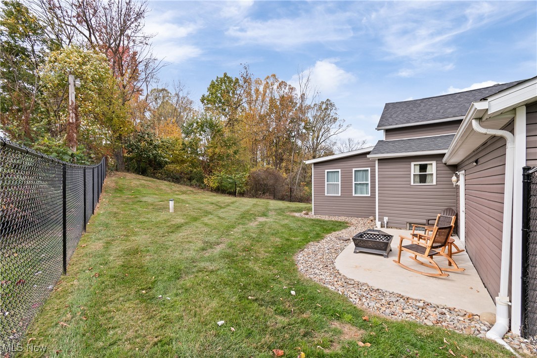 4786 Mayfair Road North Canton, OH 44720 - Photo 30 of 38 View of yard with a fire pit and a patio